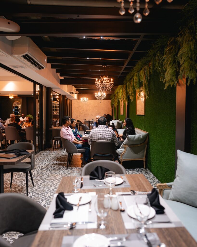 The glass-ceiling patio at The Ivy Steakhouse, Maraval