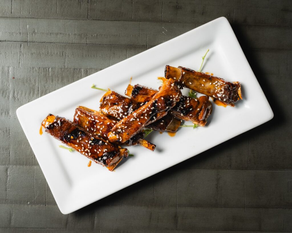 Ivy signature lamb ribs glazed in rosemary teriyaki