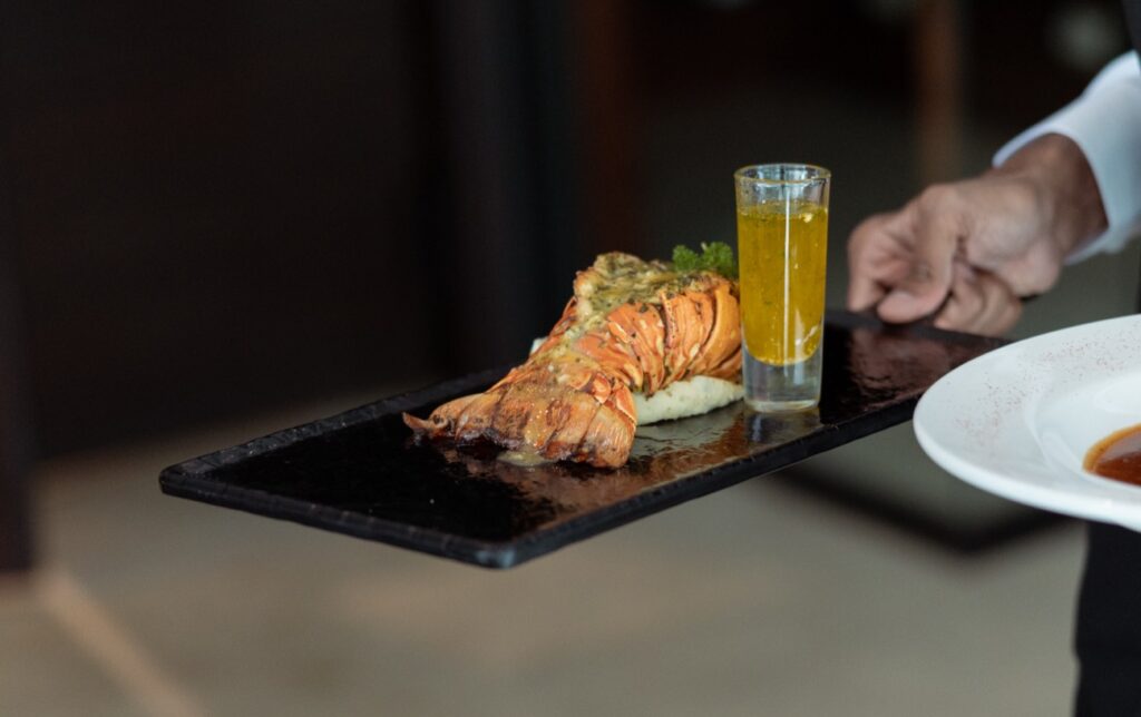 Grilled lobster tail with garlic butter at The Ivy Steakhouse