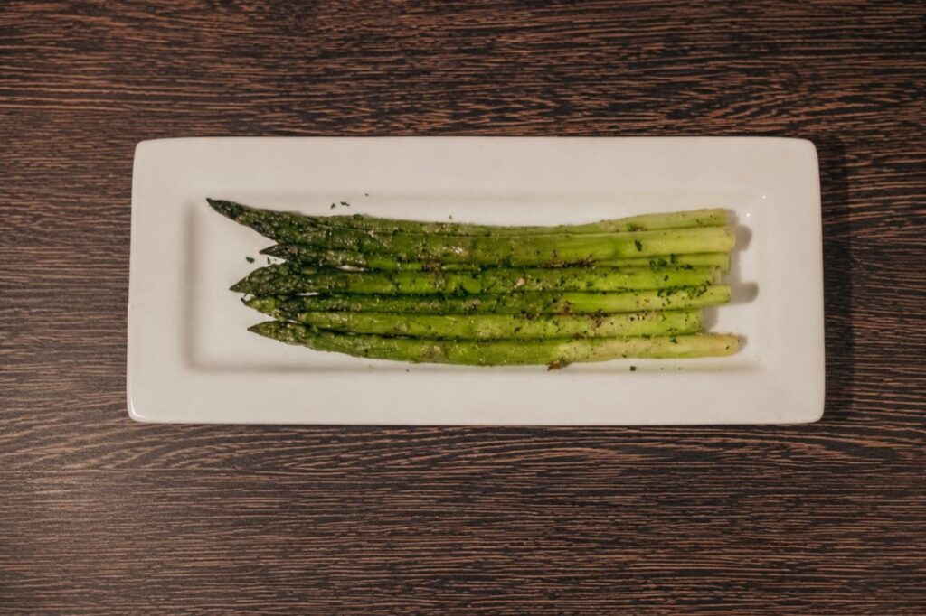 A dish of sauteed asparagus spears
