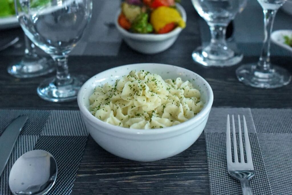 A bowl of garlic-infused creamed potatoes
